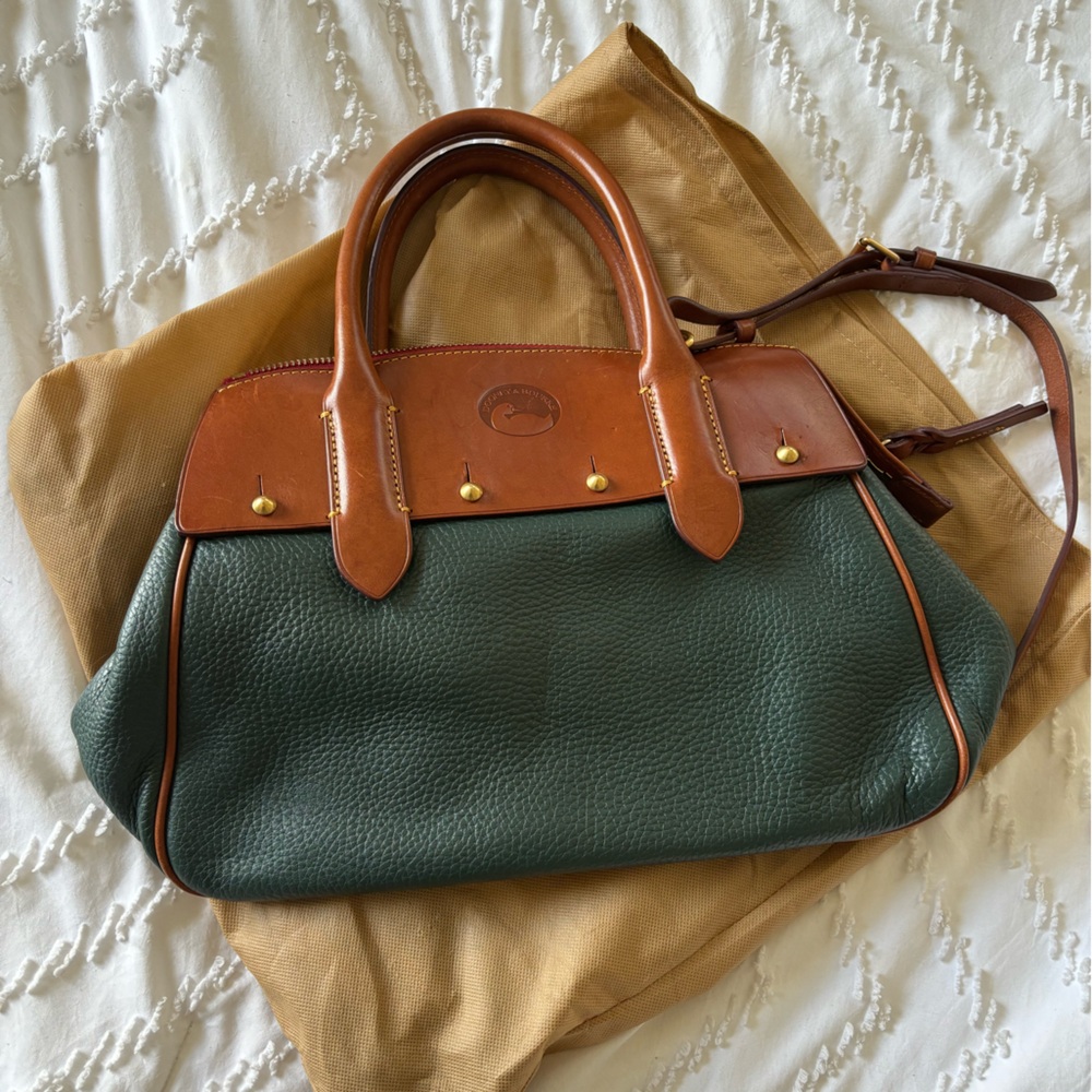 Dooney&Burke green and brown leather bag with red interior.
